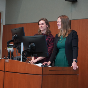 Dr. Maya Gross and Dr. Laura Cooney behind a lectern