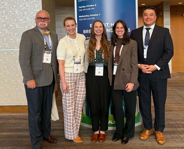The 2026 Urogynecology and Reconstructive Pelvic Surgery fellows and fellowship leaders stand together, smiling, at the annual AUGS conference.